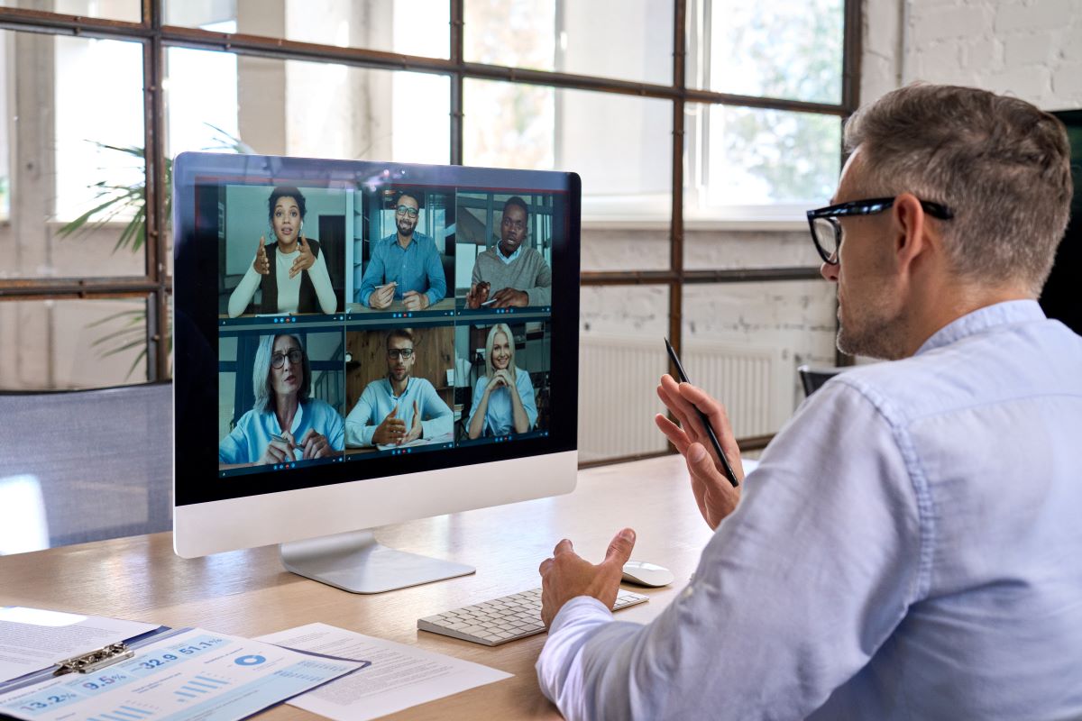 A man in a videoconference with workmates