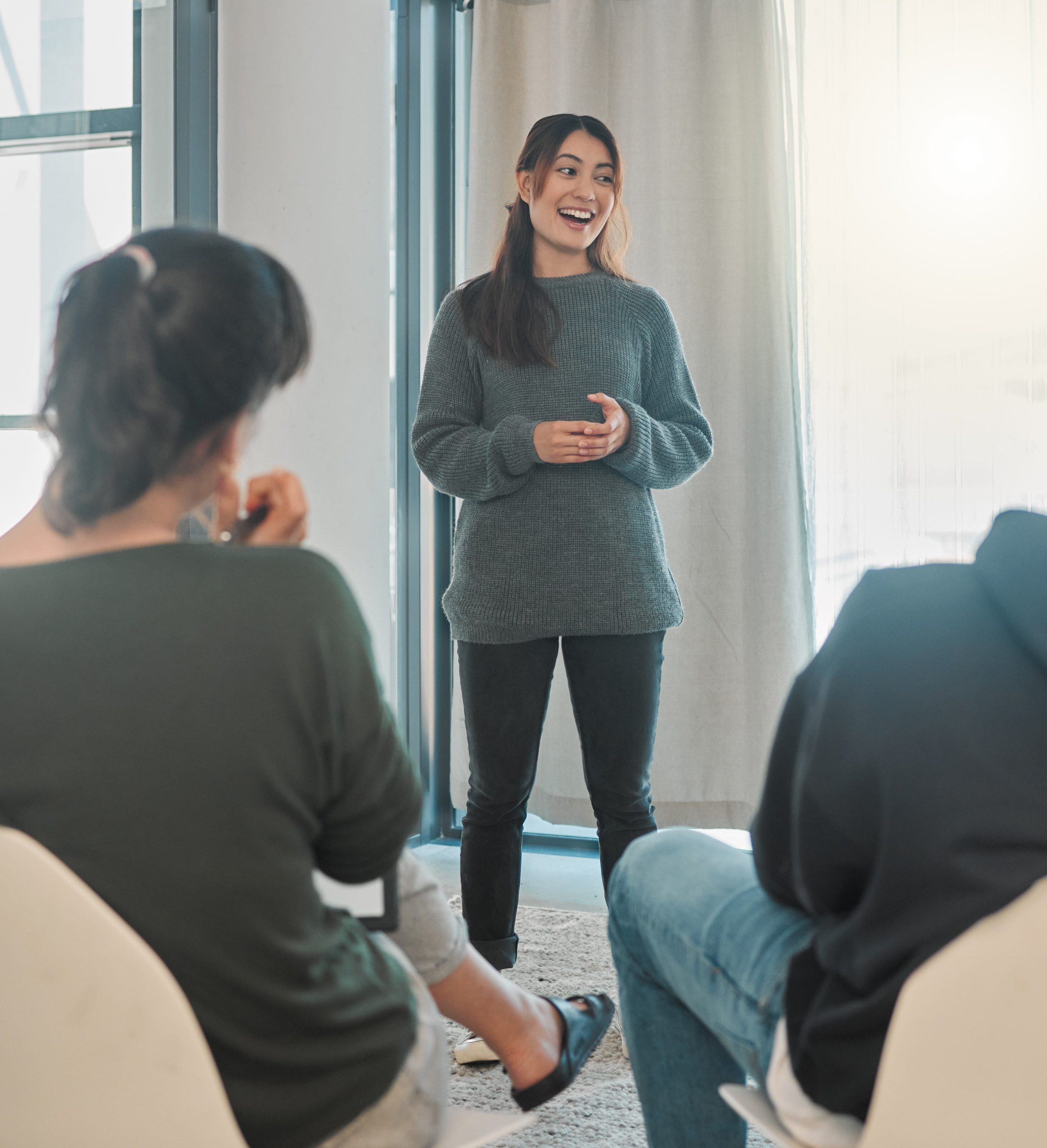 A woman delivering a group counselling session