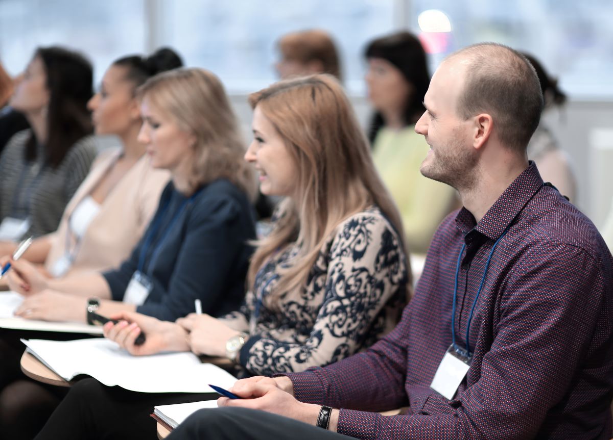 Employees listening to someone speak