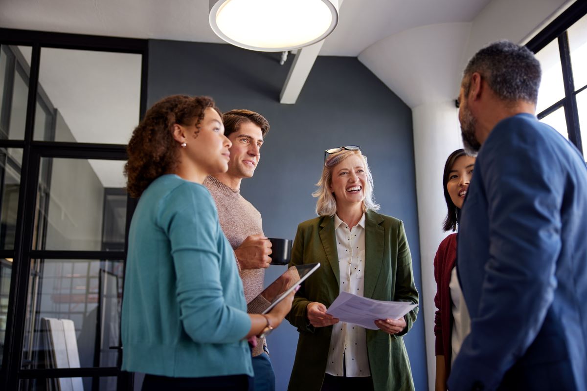 A group of work colleagues gather